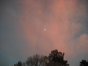The moon rises as the sunsets in Santa Fe
